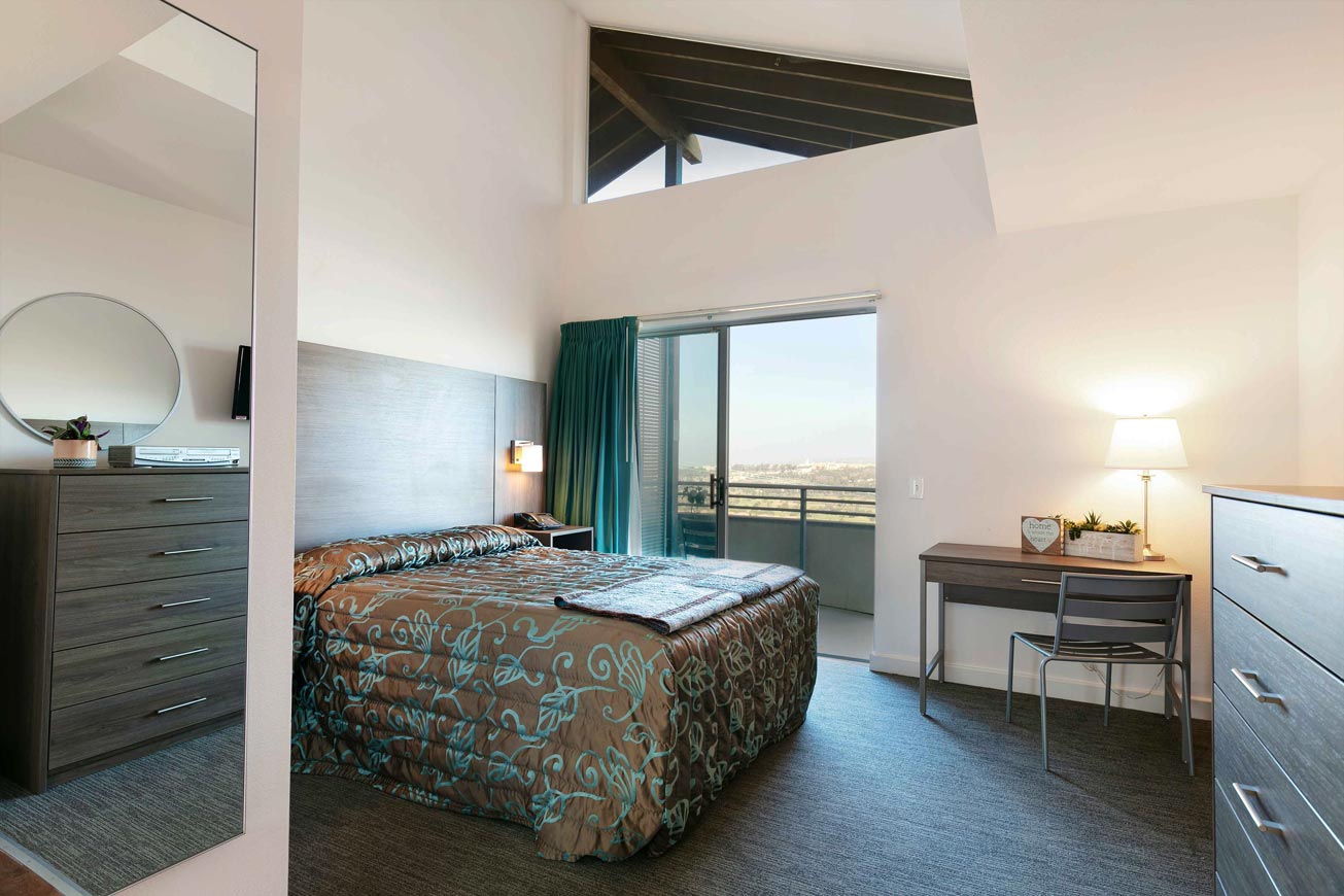 1 queen bed dresser, desk and balcony