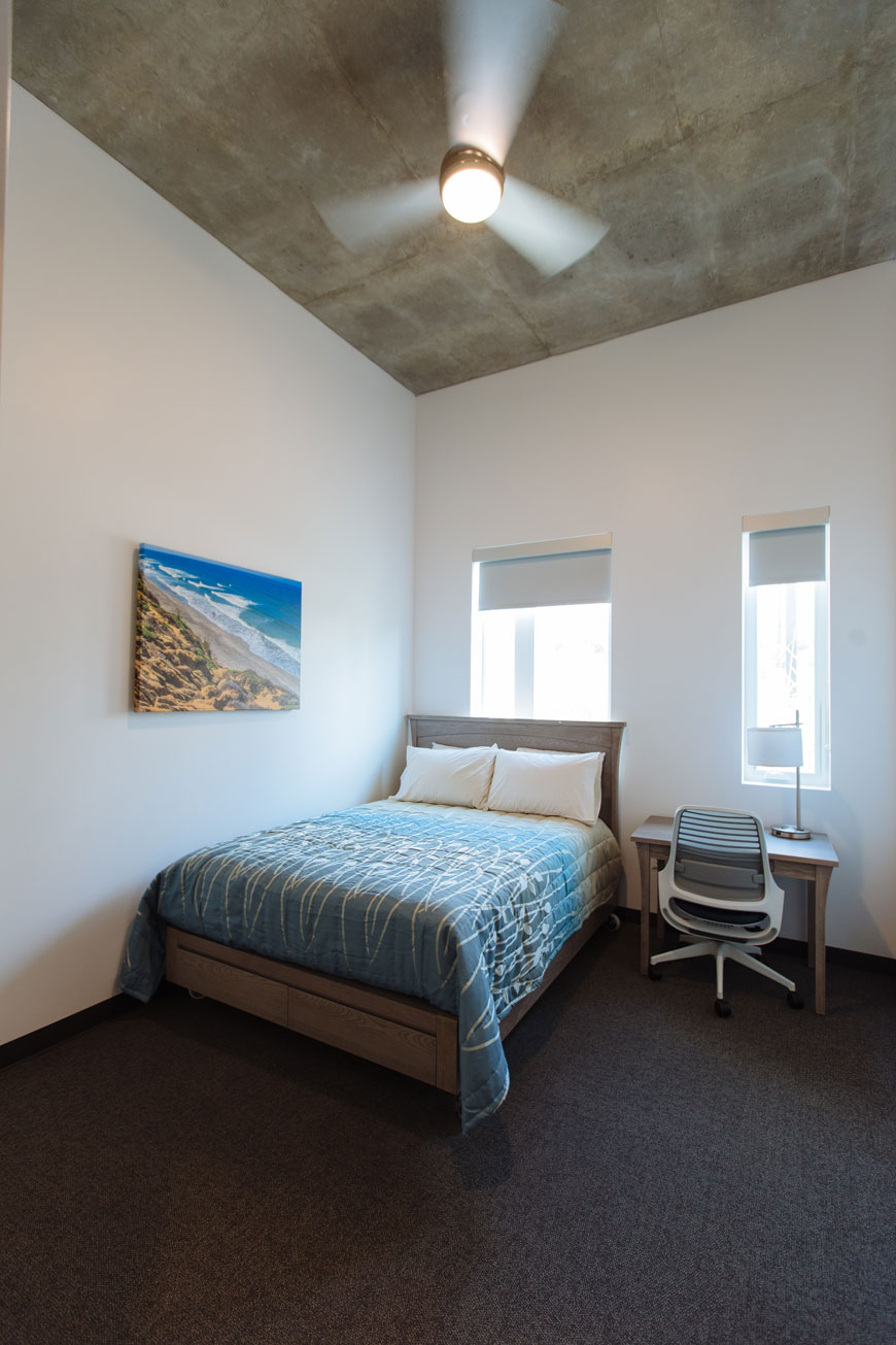 Apartment 1 queen bed with drawers and workspace