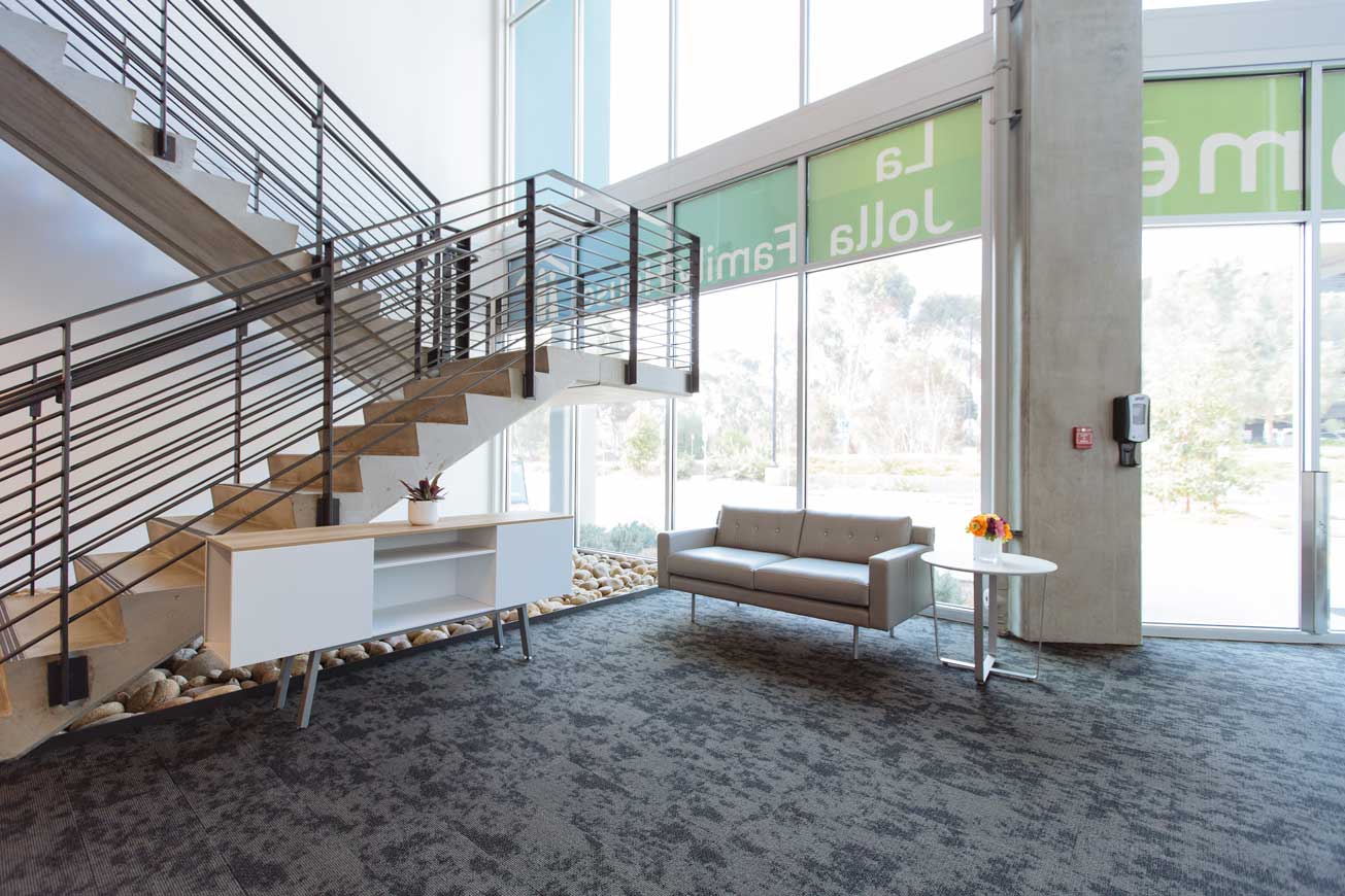 Lobby staircase and painted rock garden