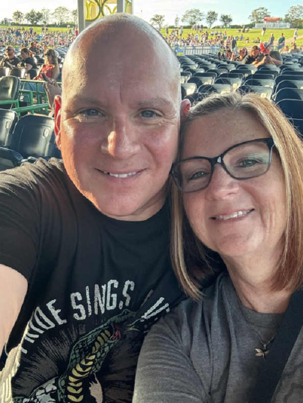 Tammie Warden with husband at concert
