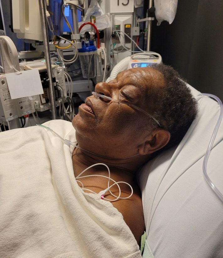 Holt in hospital bed